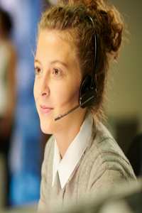 Young female wearing telephone headset