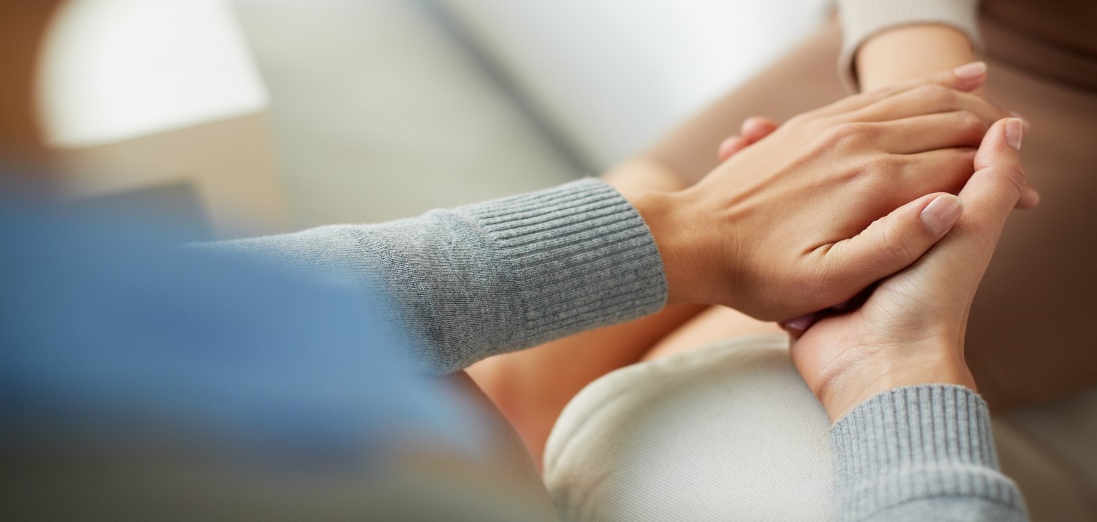 Picture of hands - couple hand in hand in comforting way