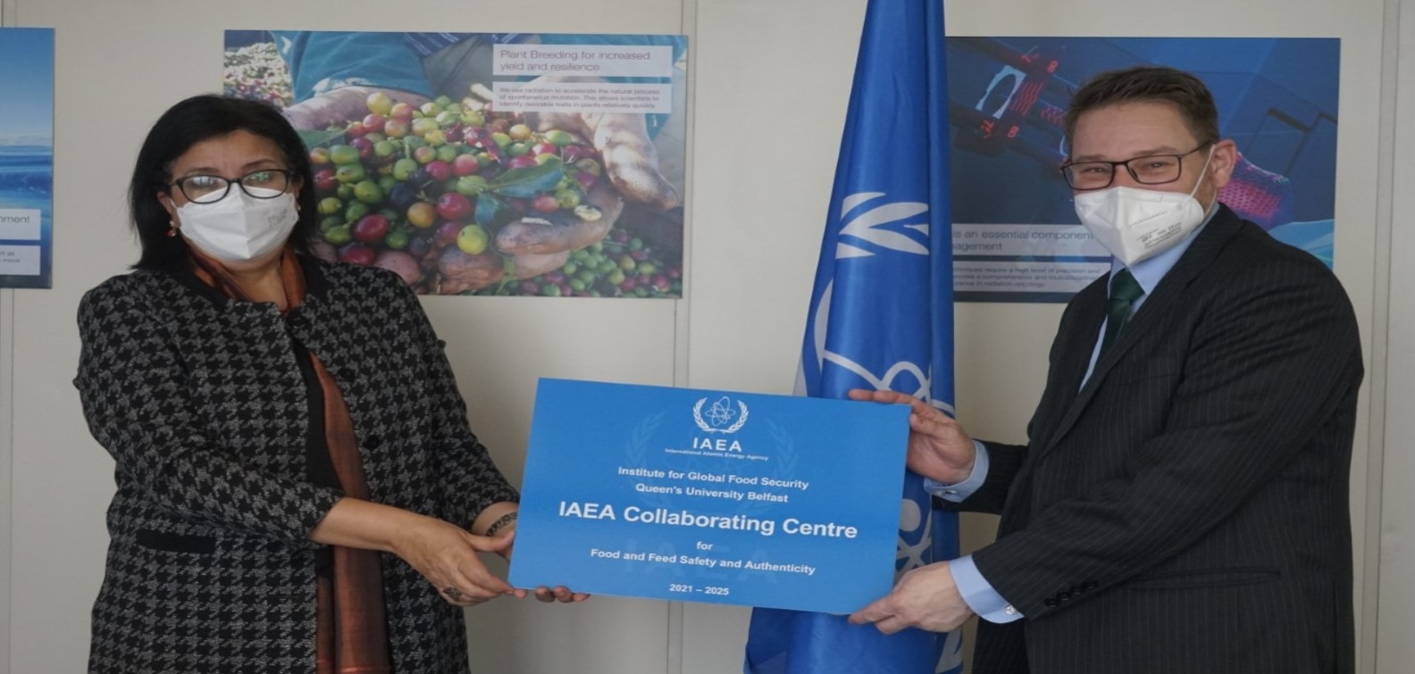 Najat Mokhtar hands plaque over to William Gatward