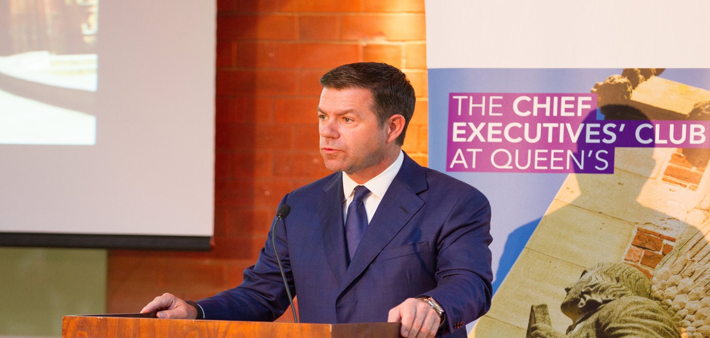 Declan Kelly at podium addressing meeting of Queen's Chief Executives' Club