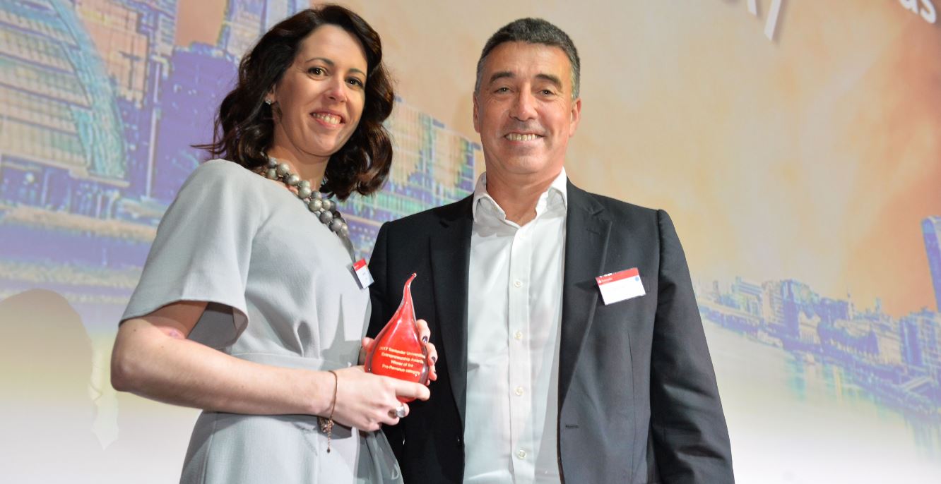 Irene Breen pictured left holding award trophy with Nathan Bostock, CEO Santander UK