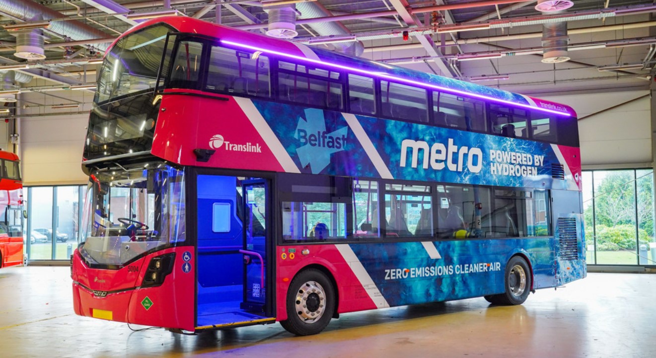 Red double deck Translink Metro hydrogen bus in garage