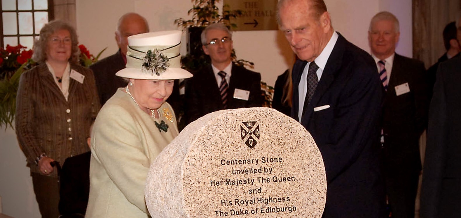 Queen Elizabeth and the Duke of Edinburgh view the Centenary Stone