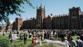 Graduation celebrations in front of Queen's Lanyon Building