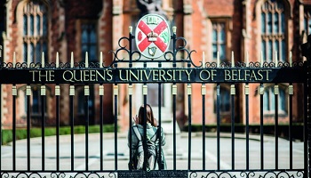 Front gates of Queen's University Belfast featuring crest