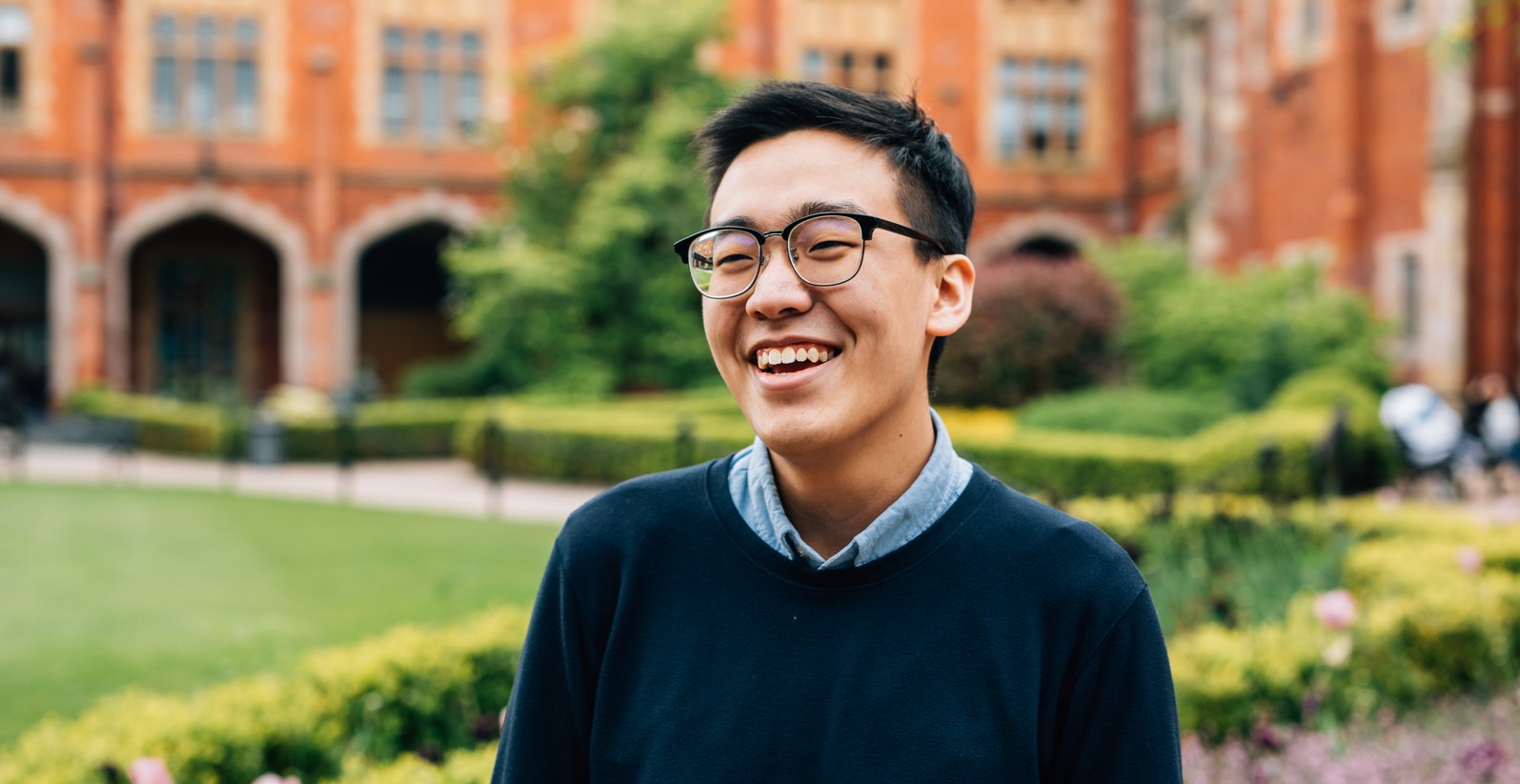 Queen's student Yi Kang Choo pictured smiling in quad at University
