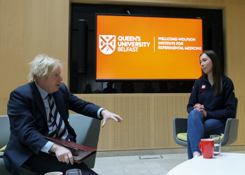 Boris Johnson speaks with Queen's staff member